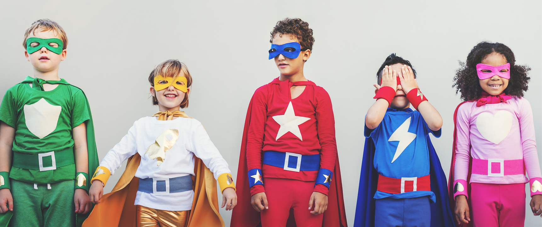 Kids in superhero costumes