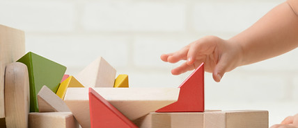 Child's Hand and Toys