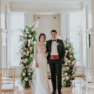 A couple pose inside Chippenham Hall