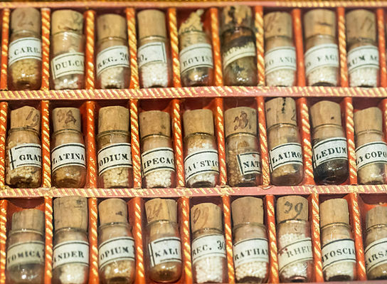 Old homeopathic pills in Admont museum, Austria, by Zdeněk Macháček Unsplash
