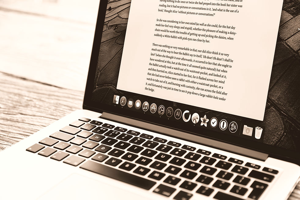 Open laptop with document and writing