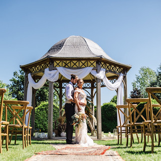 Couple posing by The Octagon ceremony venue