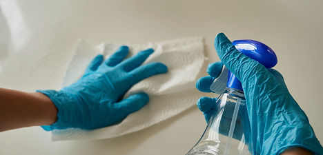 person holding blue textile near clear g