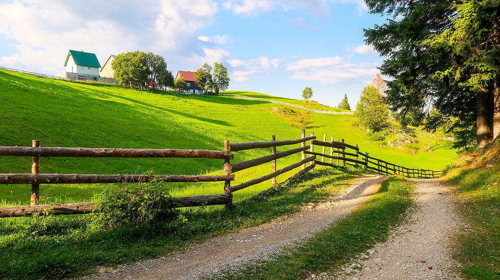 Wooden Fence and Countryside Road in Bosaca Village on Durmitor Mountain in Montenegro.jpg