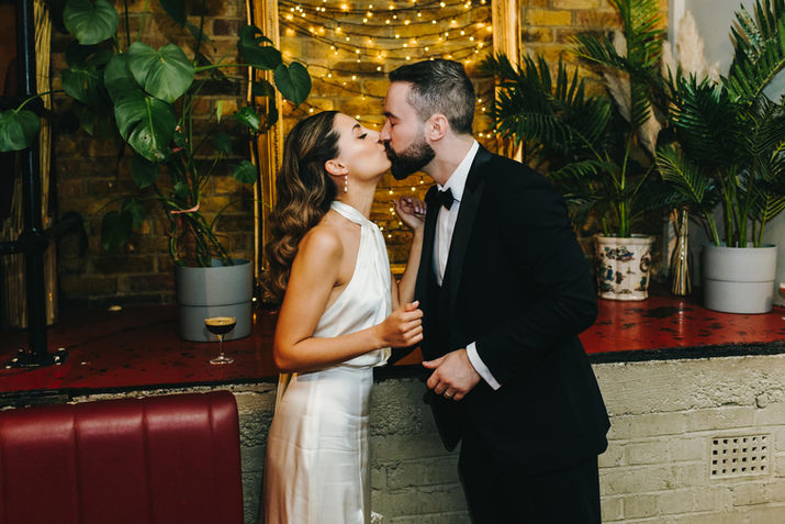Just married couple kissing and posing at The Depot, Islington.