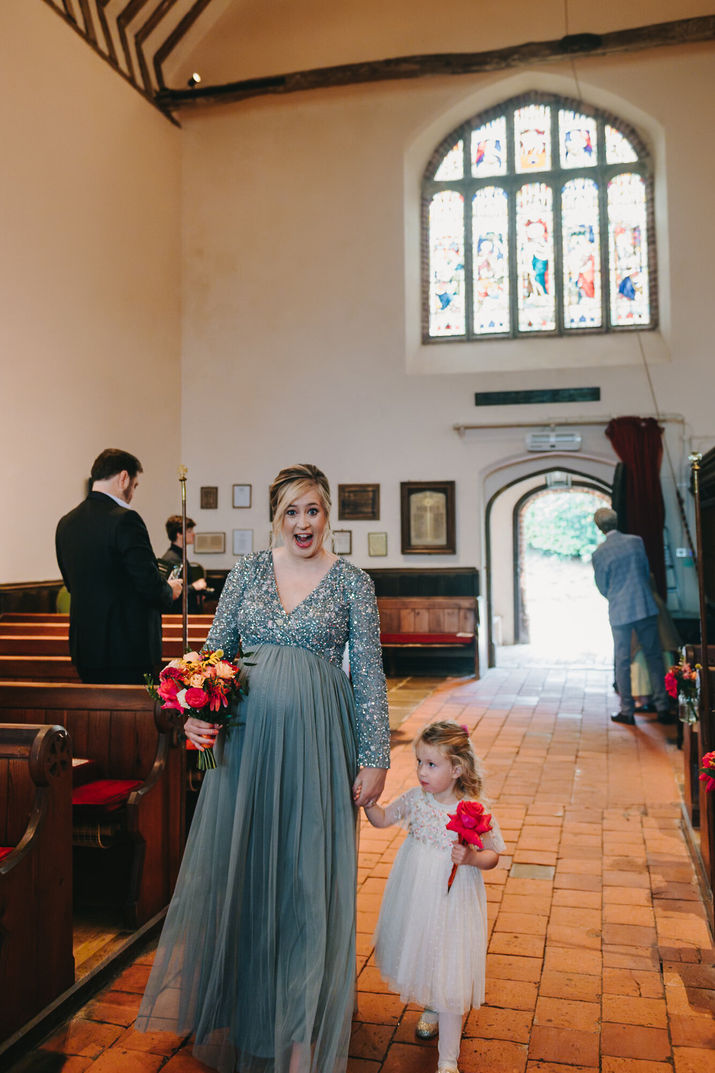Woman and girl walking through the aisle. St John The Baptist Church, Tenterden, Ashford.