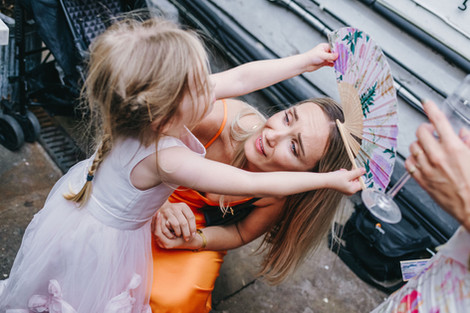 Little girl plays with woman.