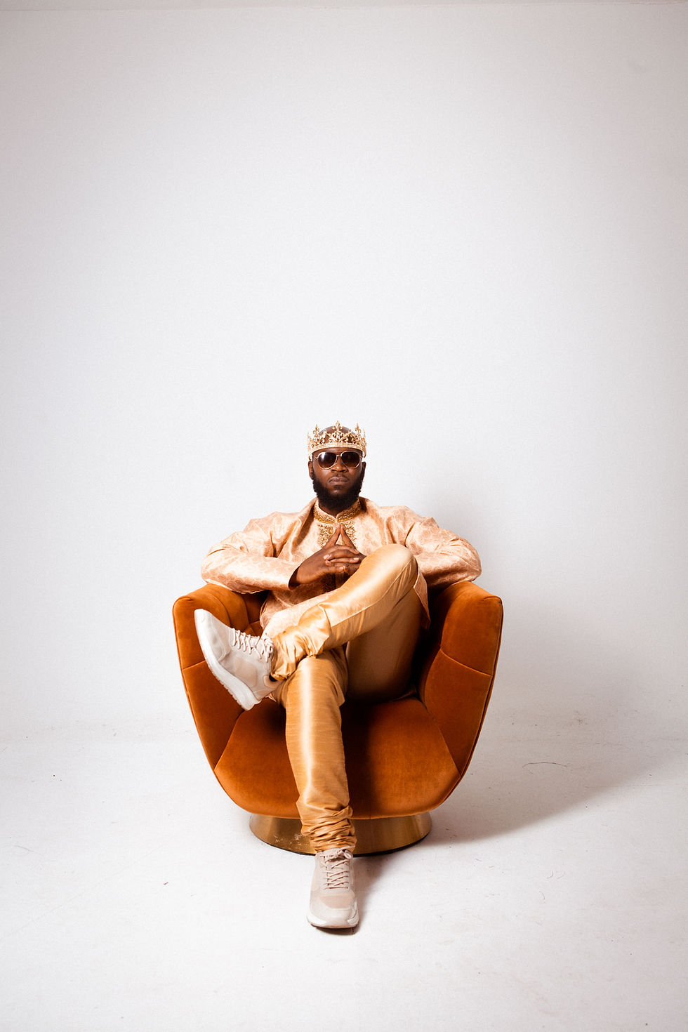 Iamkingziion Sitting on a Chair