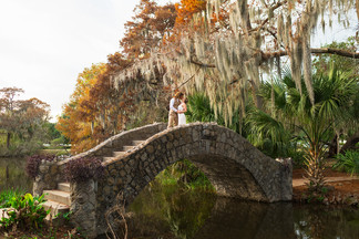 a far away photo of a couple standing on top of langles bridge