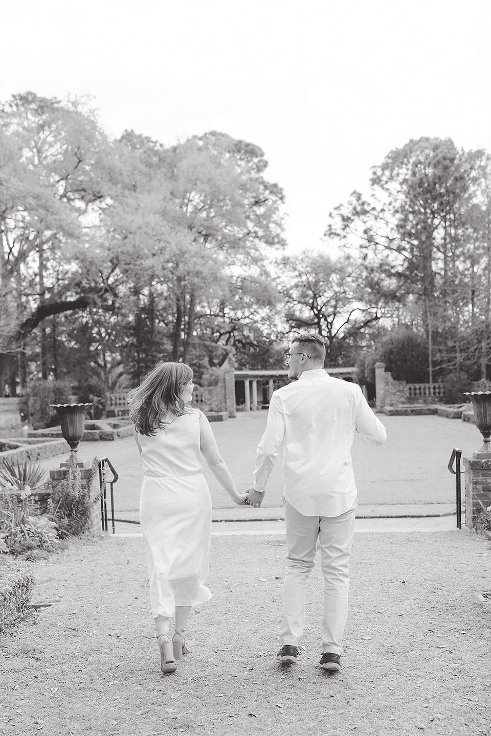 couple running away from the camera looking at each other