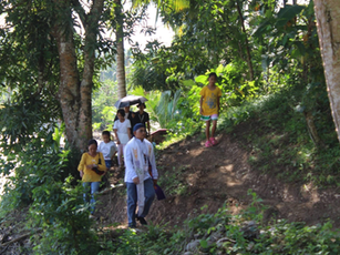 Parish Mission Team cross creeks and rivers to visit the youth, sick and elderly 