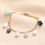 Thumbnail: Semi Precious Blue Bead and Pearl Charm Bracelet in Gold