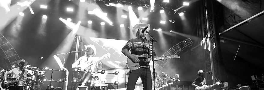 Musician performing live on stage for group sales events.