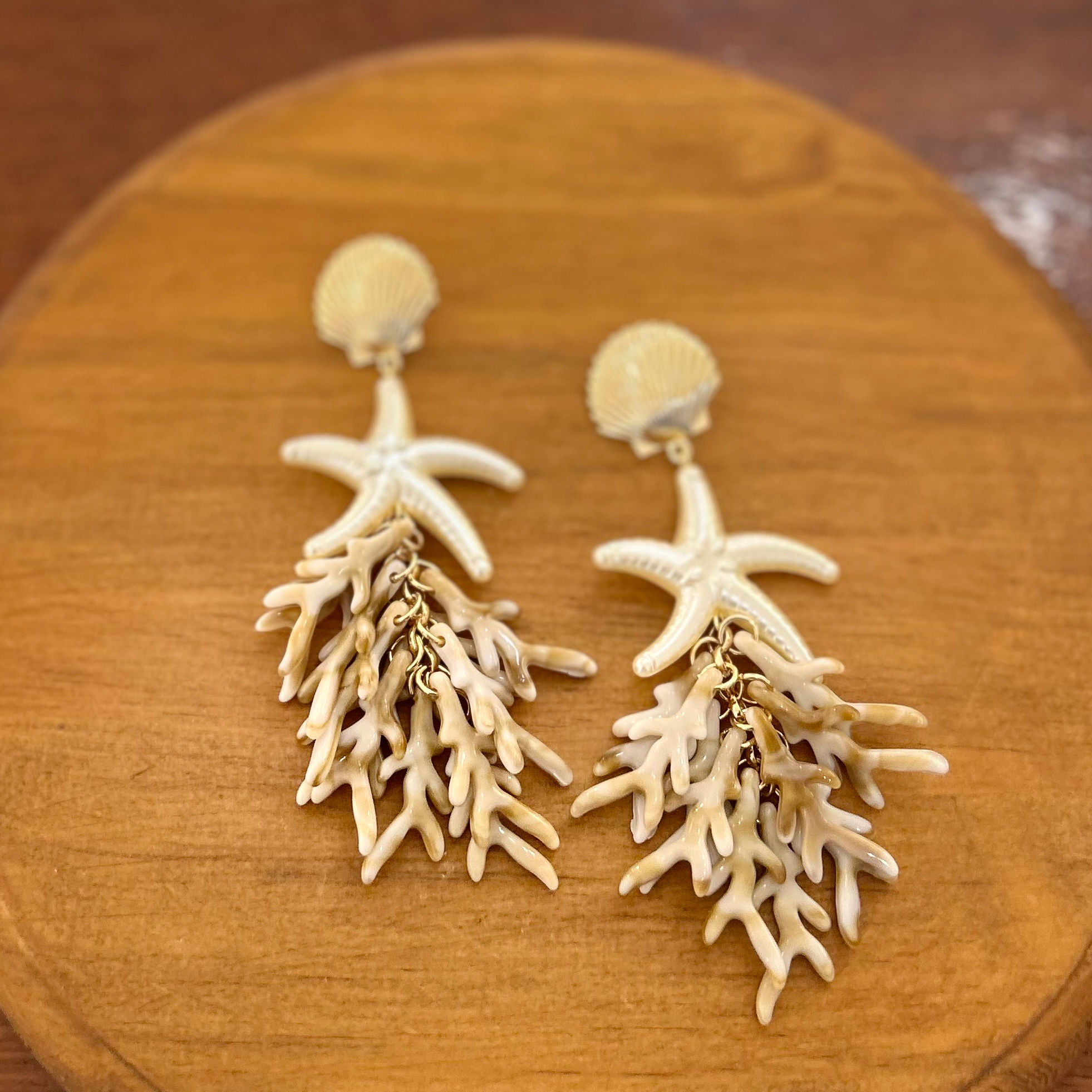 Brincos estrela coral 