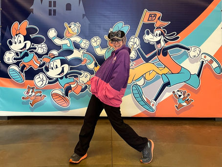 RunDisney Marathon weekend posing in front of Disney Characters