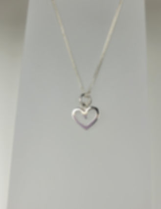 Tiny heart pendant.   Centre