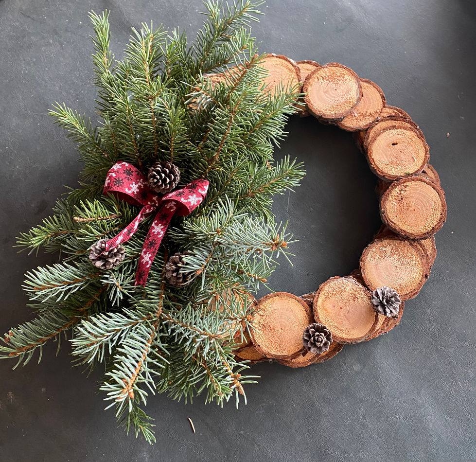 Rustic wood slice wreath, evergreen, red bow, pinecones. Seasonal Wreaths and Swags.