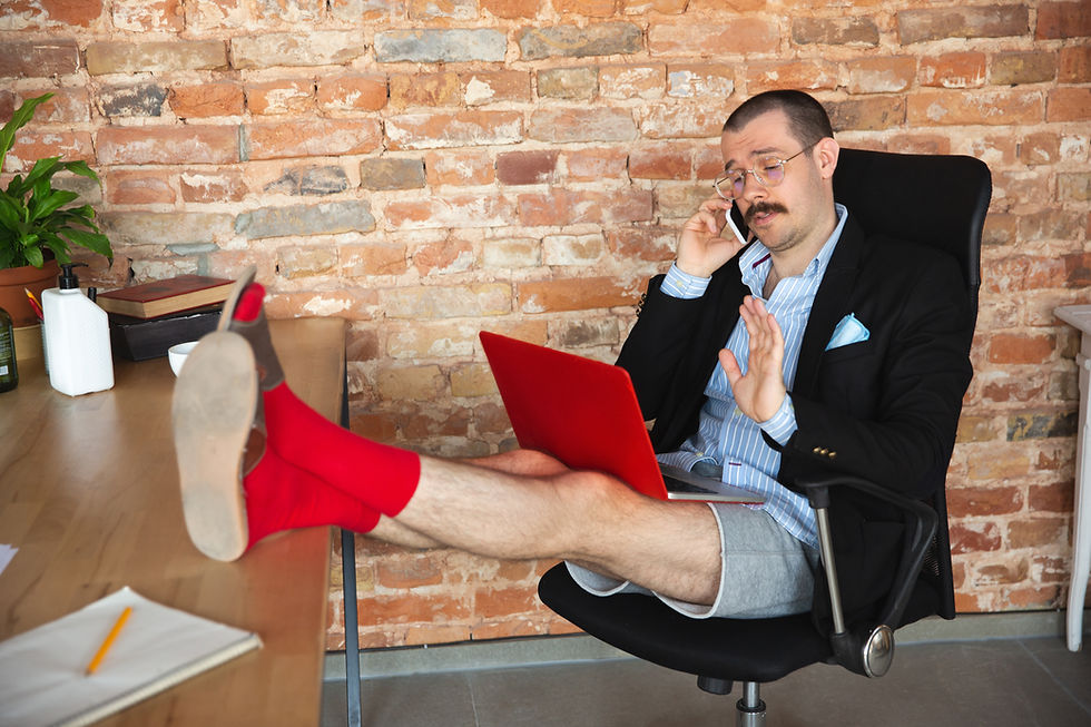 man working from home in shorts and Red Sox