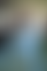 AI of Black model with a lot of fingers dressed in CRITTER monochromatic look sitting on floor of hotel room next to models.