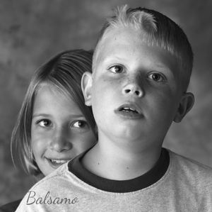 Professional photograph by Thomas Balsamo of sister behind her brother who has autism. Provided by Hearts and Lens non profit organization.