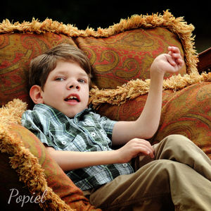 Photo of boy with physical disability by Hearts and Lens-trained photographer Laura Popiel.