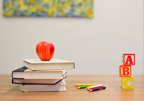 red apple fruit on four pyle books_edited.jpg