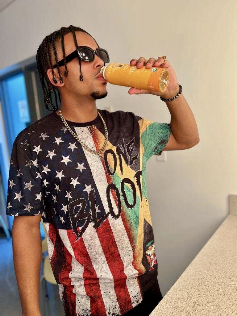 Yung Wylin drinking Garden of Flavor energy drink before performing