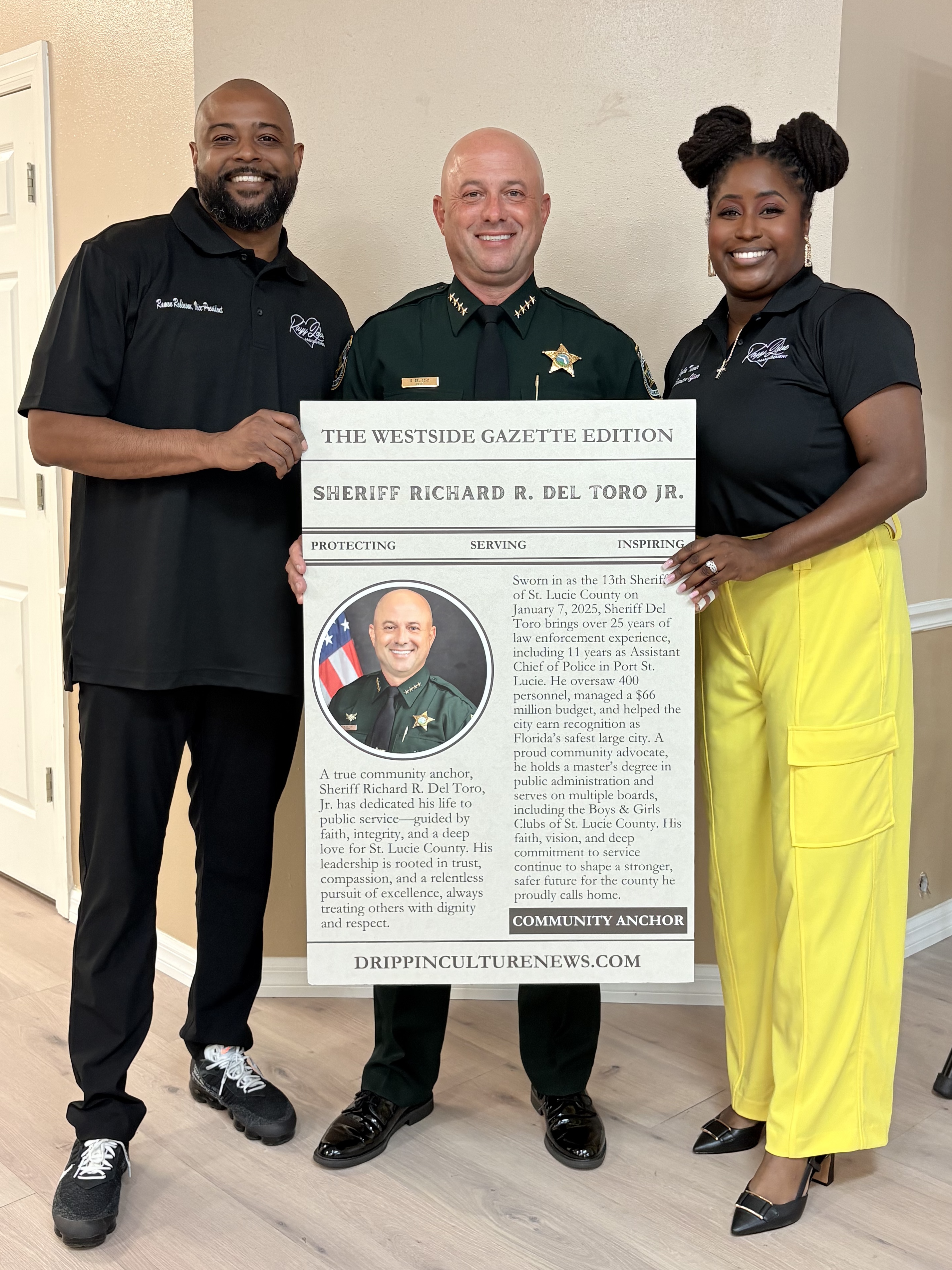Ramon Robinson and Kalya Turner posing with trading card recipient Sheriff Richard R. Del Toro, Jr.
