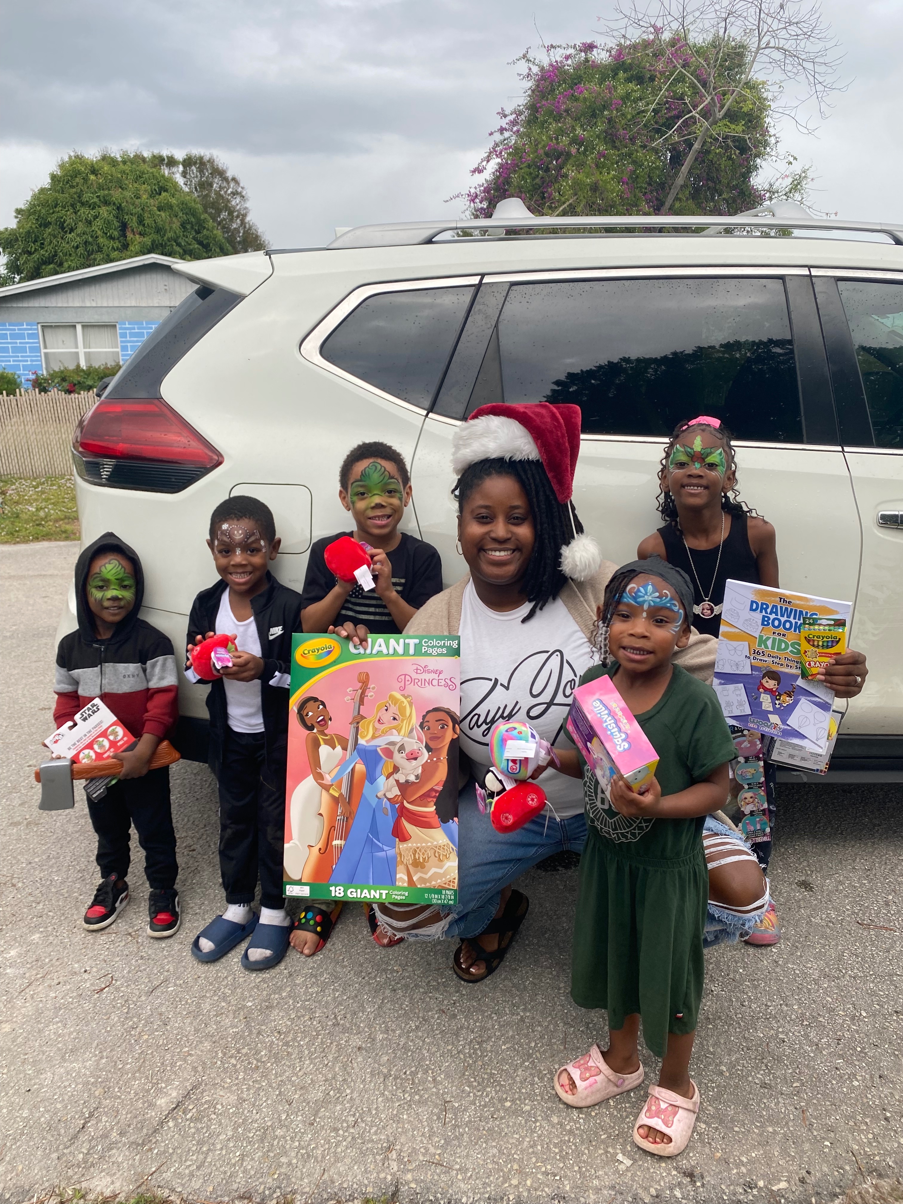 Kayy Love dropping off toys to youth in Fort Pierce.