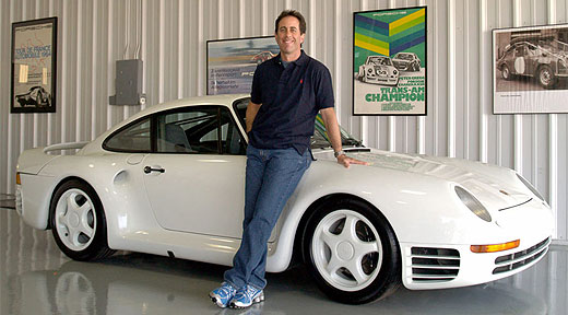 Jerry Seinfeld standing next to Porsche 959