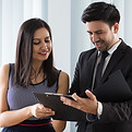 smiling-confident-colleagues-examining-document-together.jpg