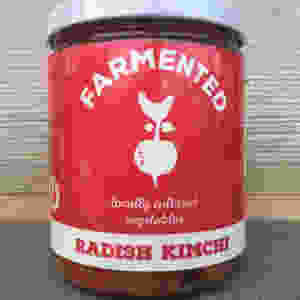 glass jar with white lid and red and white label
