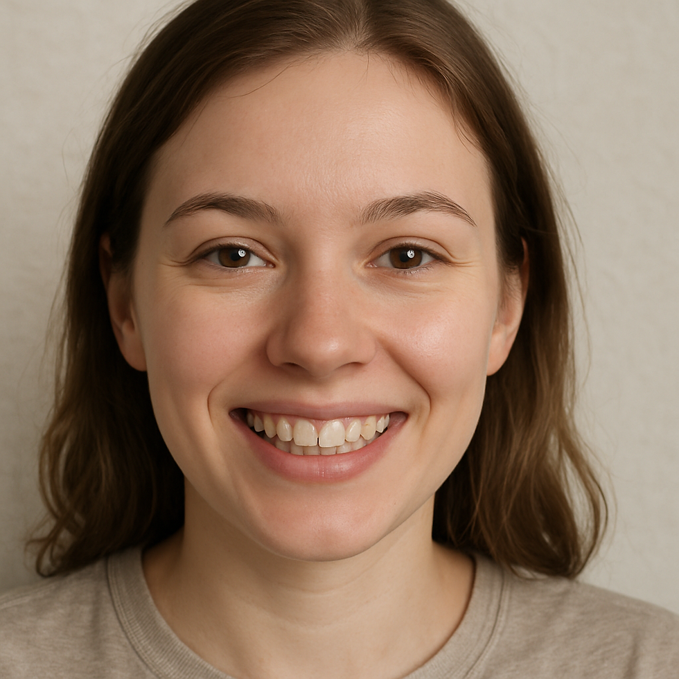 Smiling person with long brown hair, wearing a beige shirt. Neutral background. Bright and happy expression.