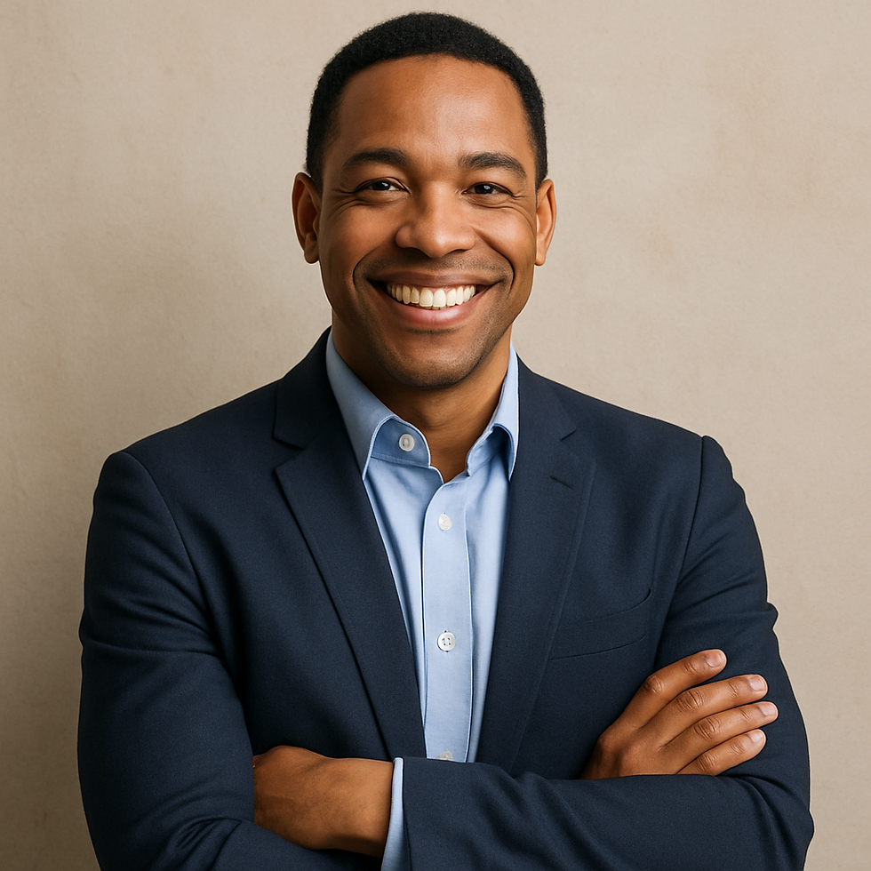 Smiling person in a navy suit and blue shirt with folded arms against a beige background. The mood is friendly and confident.