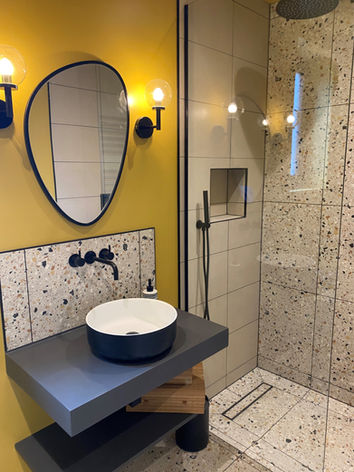 Terrazzo and gold shower room design