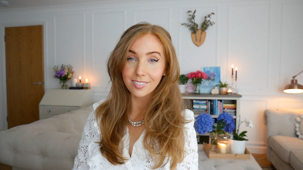 Edinburgh content creator smiling in a bright room with flowers
