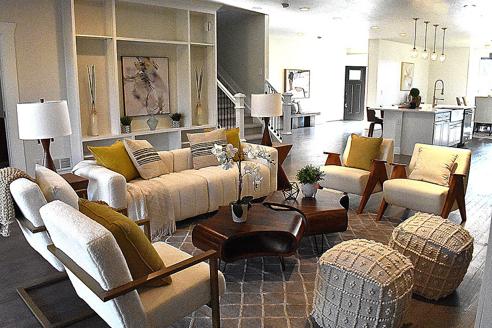 Wide angle view of a staged Colorado mountain home living room with rustic furniture and cozy decor