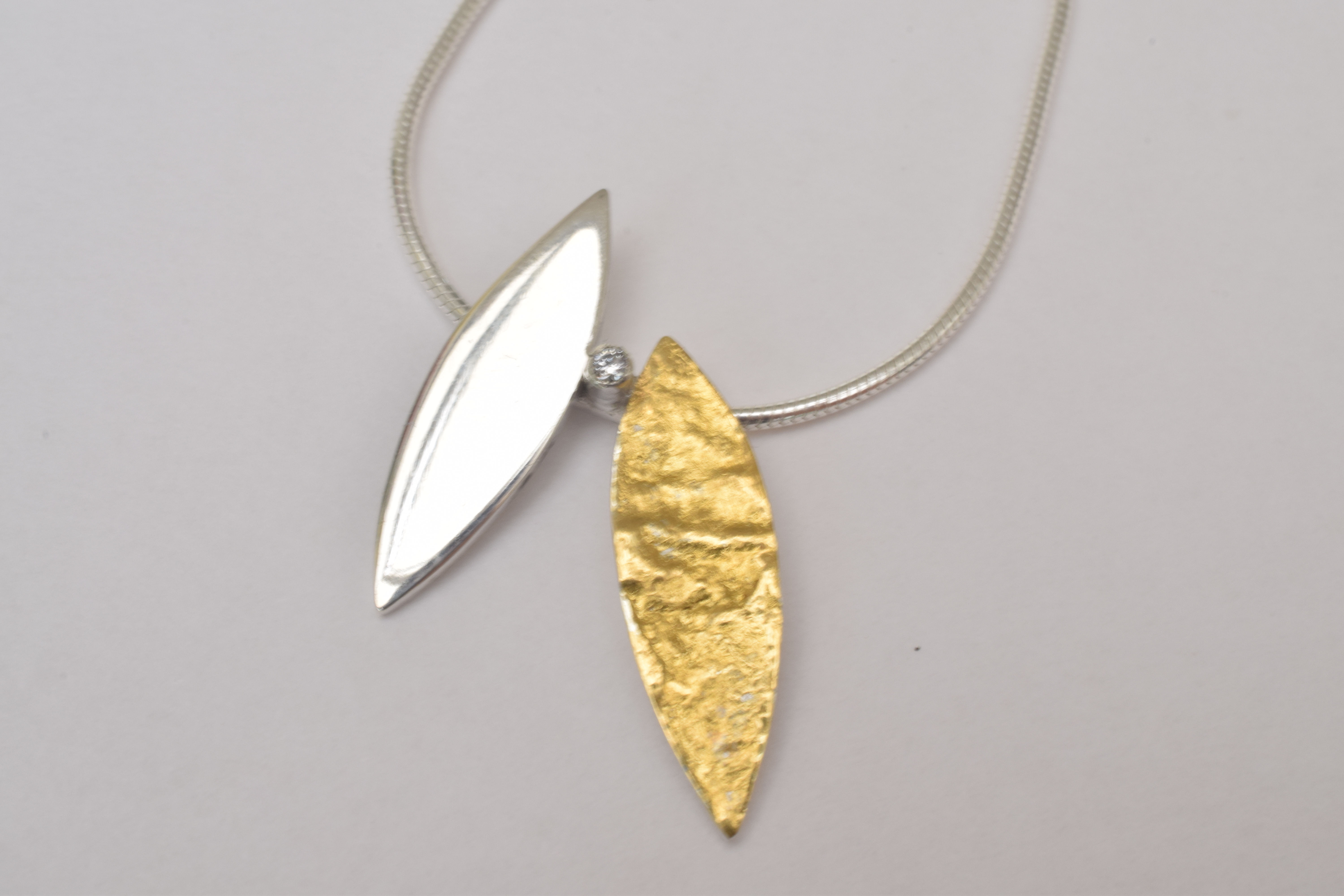Double Leaf Pendant with a Cubic Zirconia