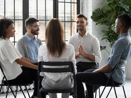 A group of professionals sitting in a circle. 