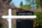 COMING SOON sign near a house for sale in a residential neighborhood