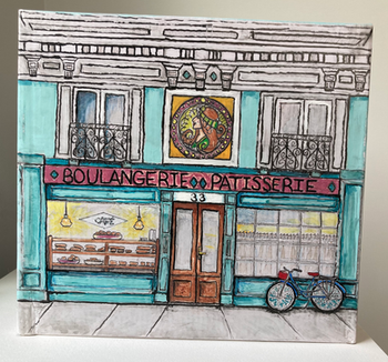 Front view of a miniature French boulangerie with patisserie window display, café curtains, bicycle, Art Deco relief, balconies, and painted architectural details.