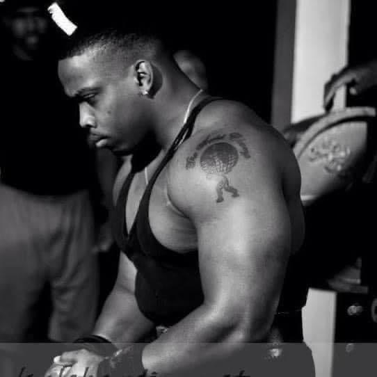 Black and white photo of Claude Bouyer focused on the bench before a lift