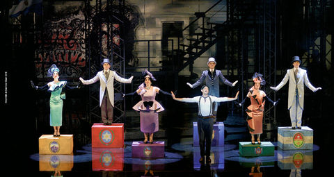 a group of people standing on boxes