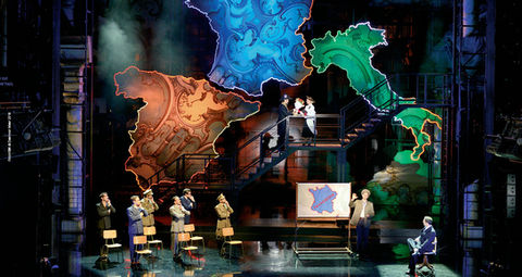 a group of people standing in front of a map of Europe