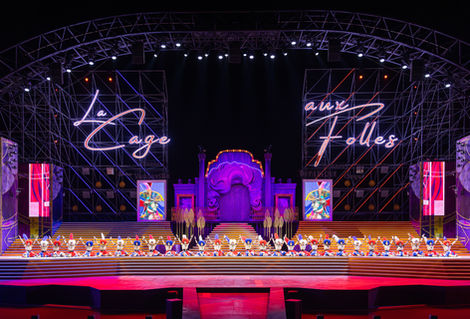 A wide line of dancers at the end of the Can Can from La Cage Aux Folles