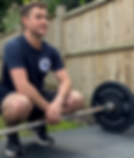 Trainer Aaron with deadlift barbell