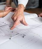 Company owner reviewing the plans for a project.