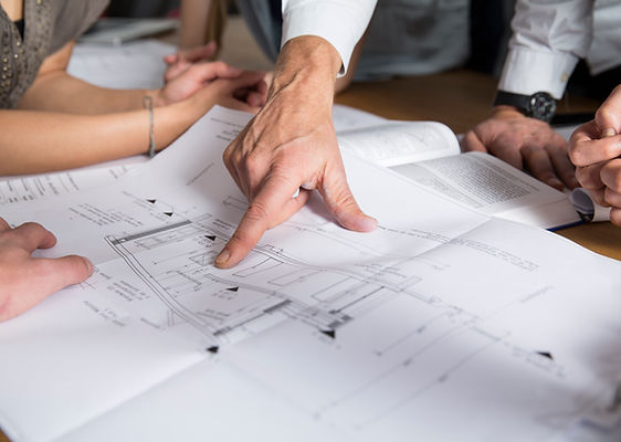 MO Builders team reviewing architectural plans and material selections