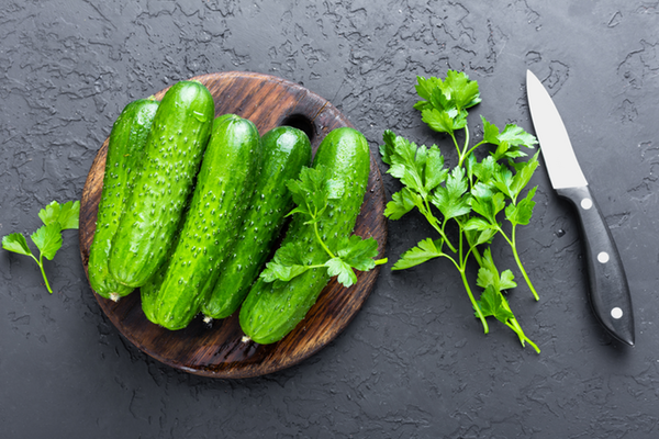 cucumbers-fresh-cucumbers-on-wooden-board-PZ862QD.png