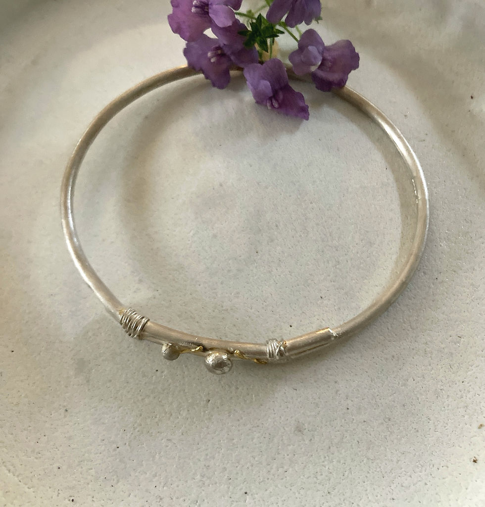 Thumbnail: Sterling silver bangle with gold details
